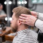 Photo of a barber giving a haircut