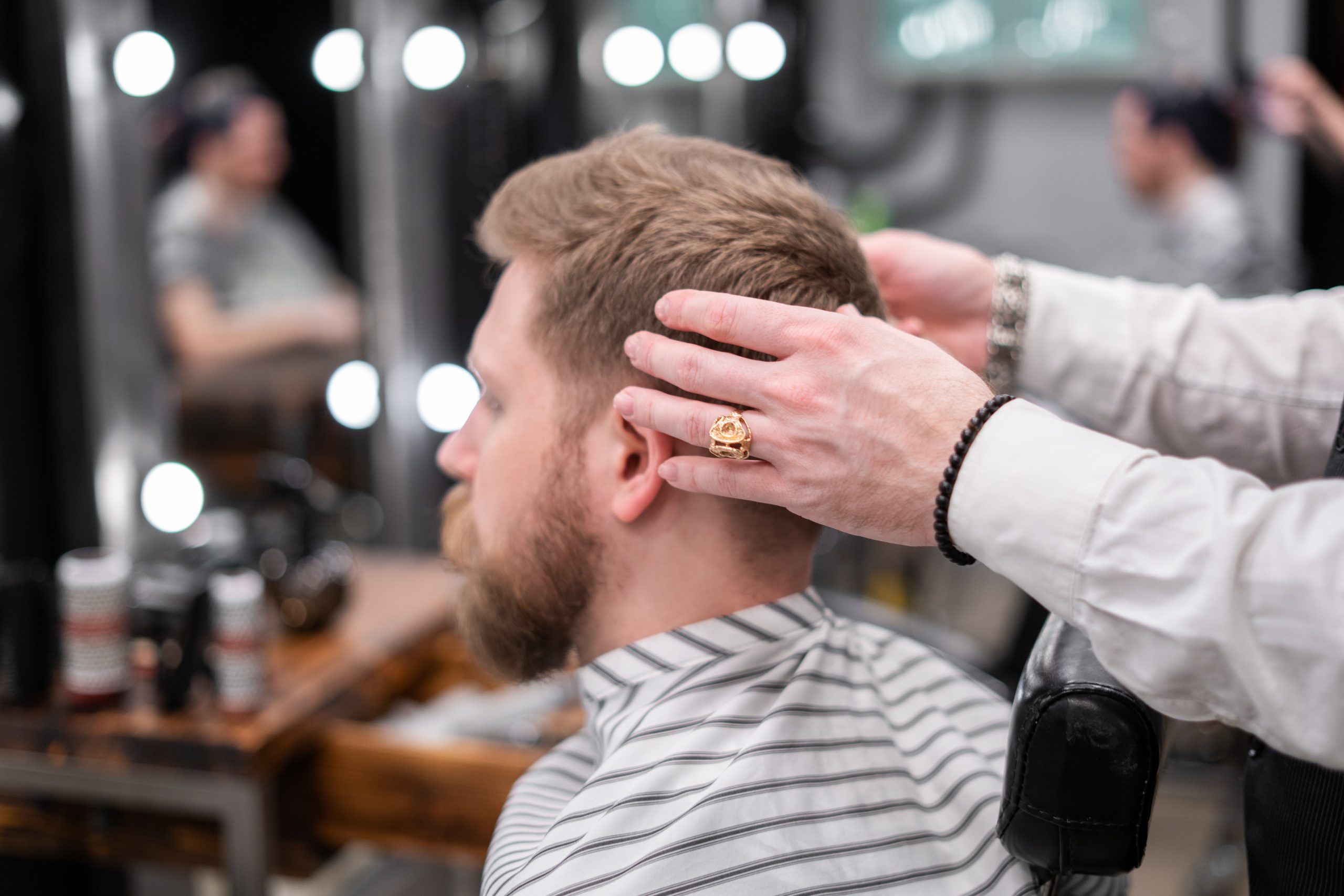 Photo of a barber giving a haircut