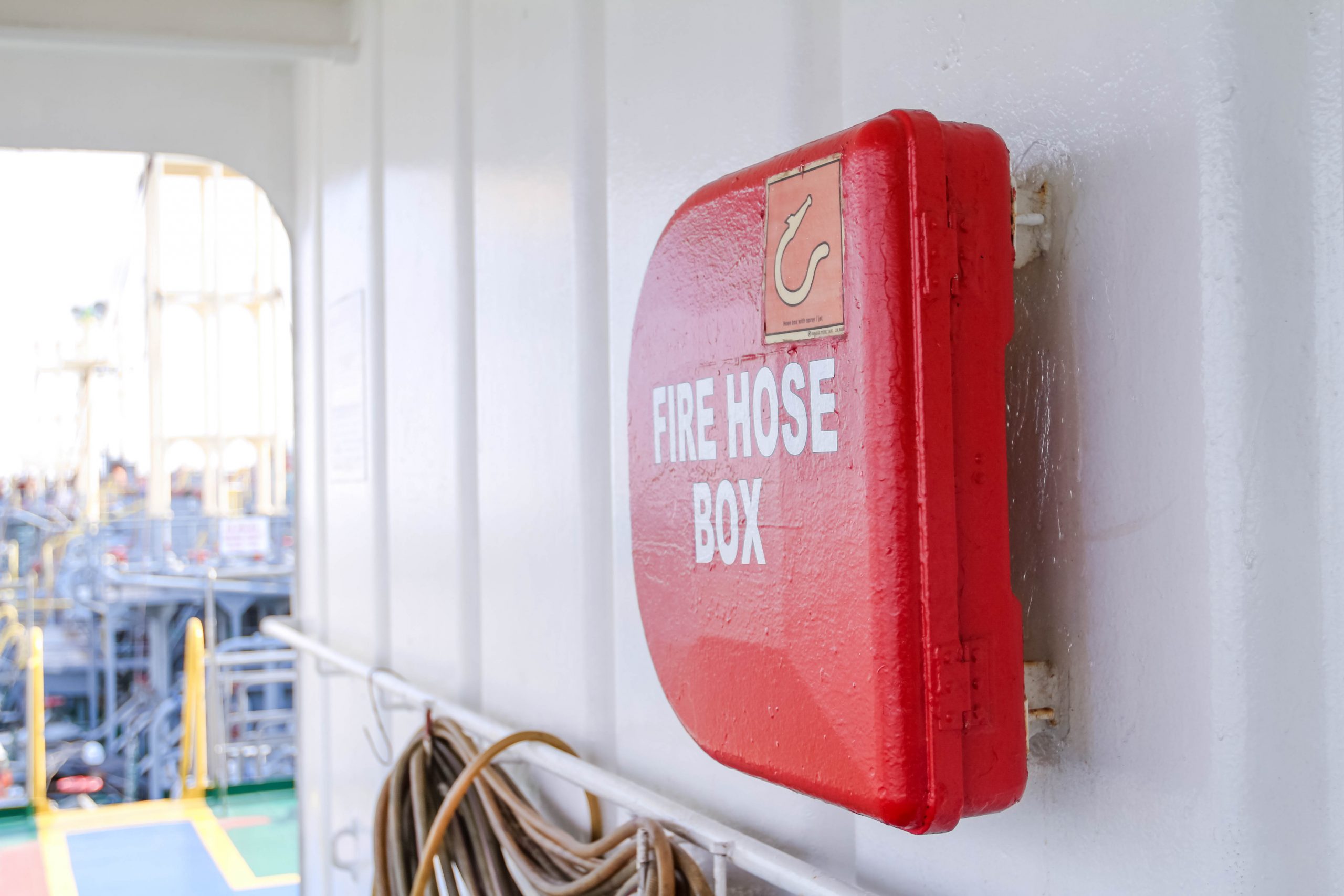 Red fire hose box on focus photo