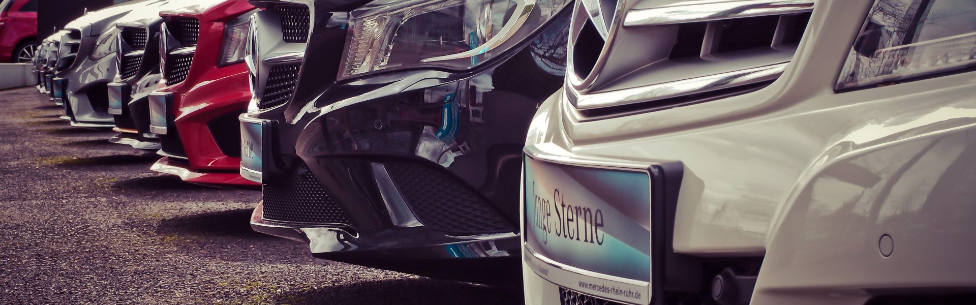Mercedes benz parked in a row