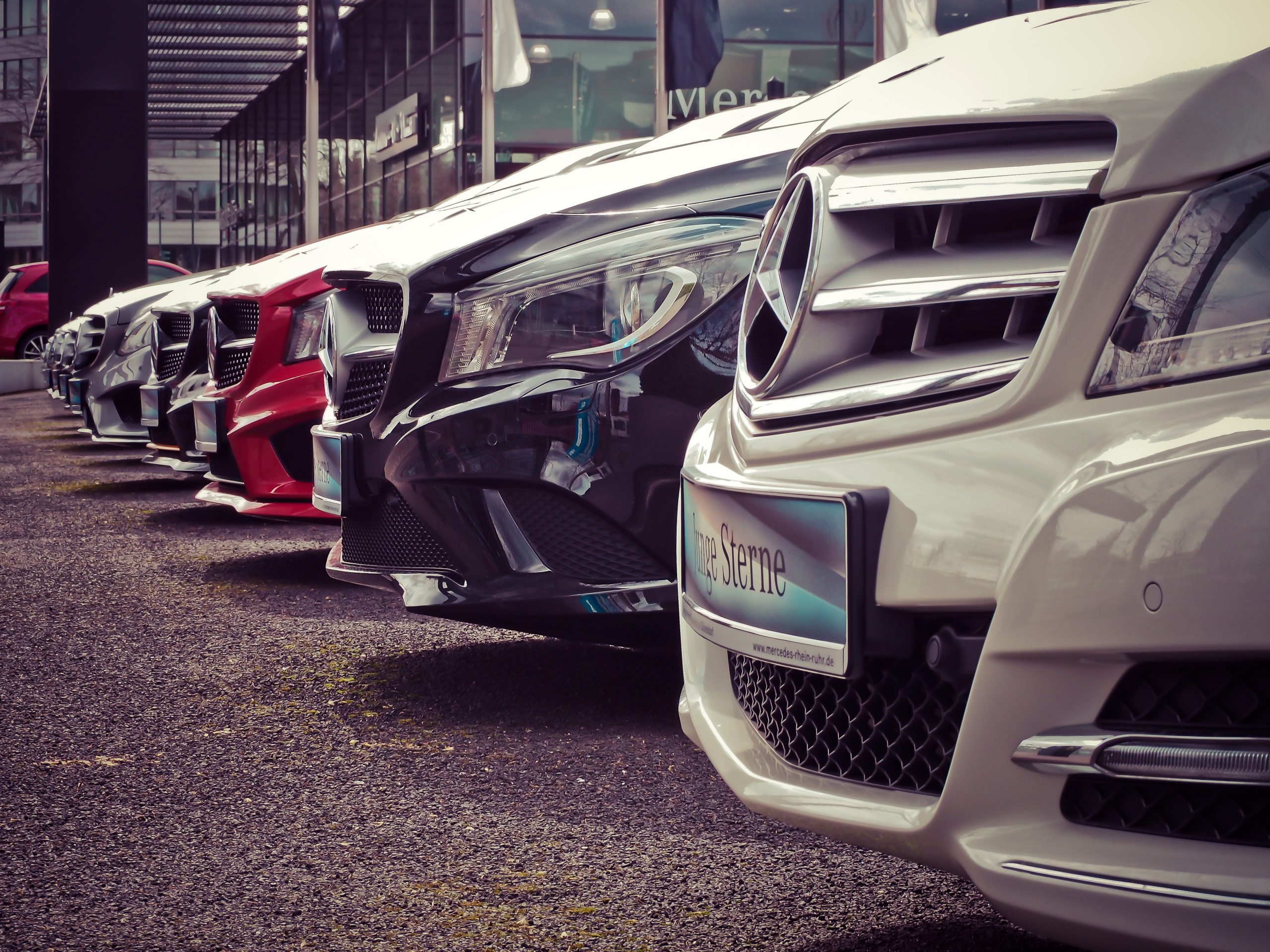 Mercedes benz parked in a row